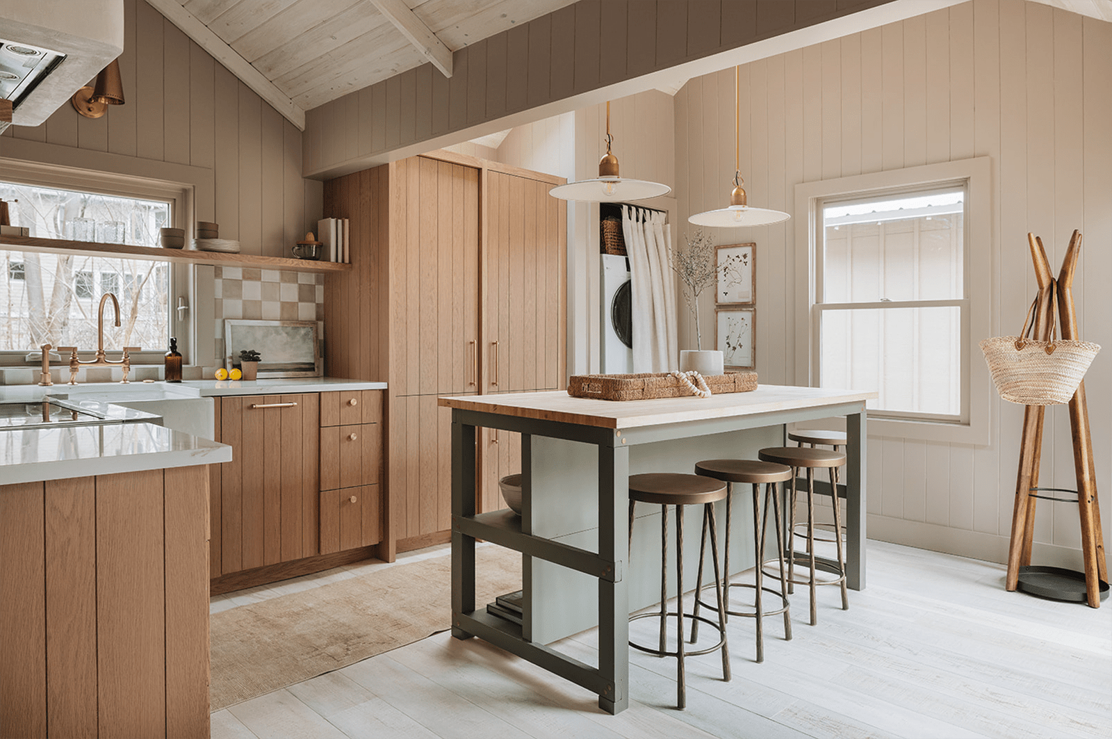 green kitchen island and wooden cabinets
