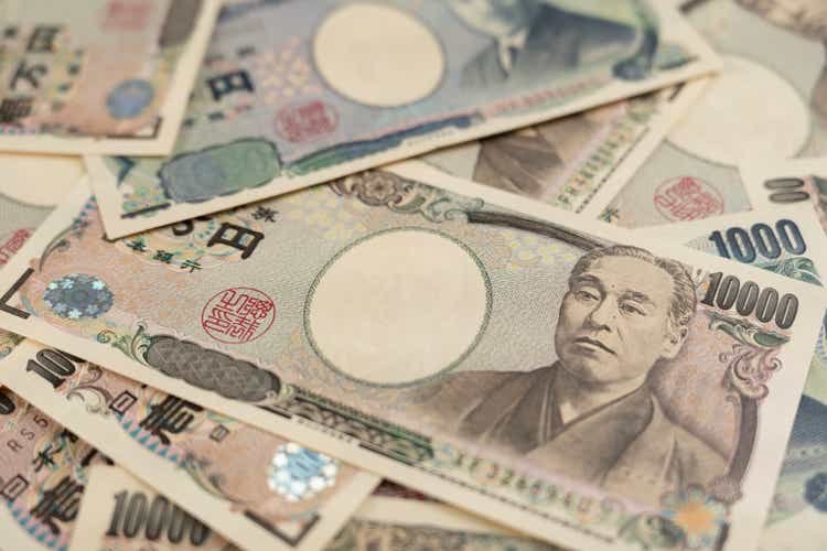 close to money japanese banknotes. A bundle of bills. Background on the theme of banks, finance and Japan's economy