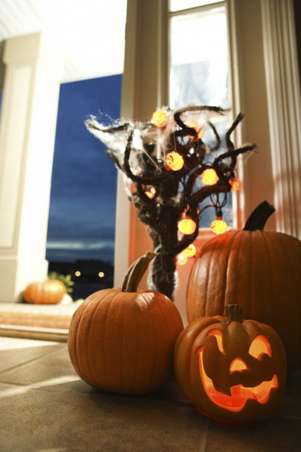 Decorating with strategically placed lights and pumpkins enhances the holiday atmosphere outside your house. (Metro Creative Services)