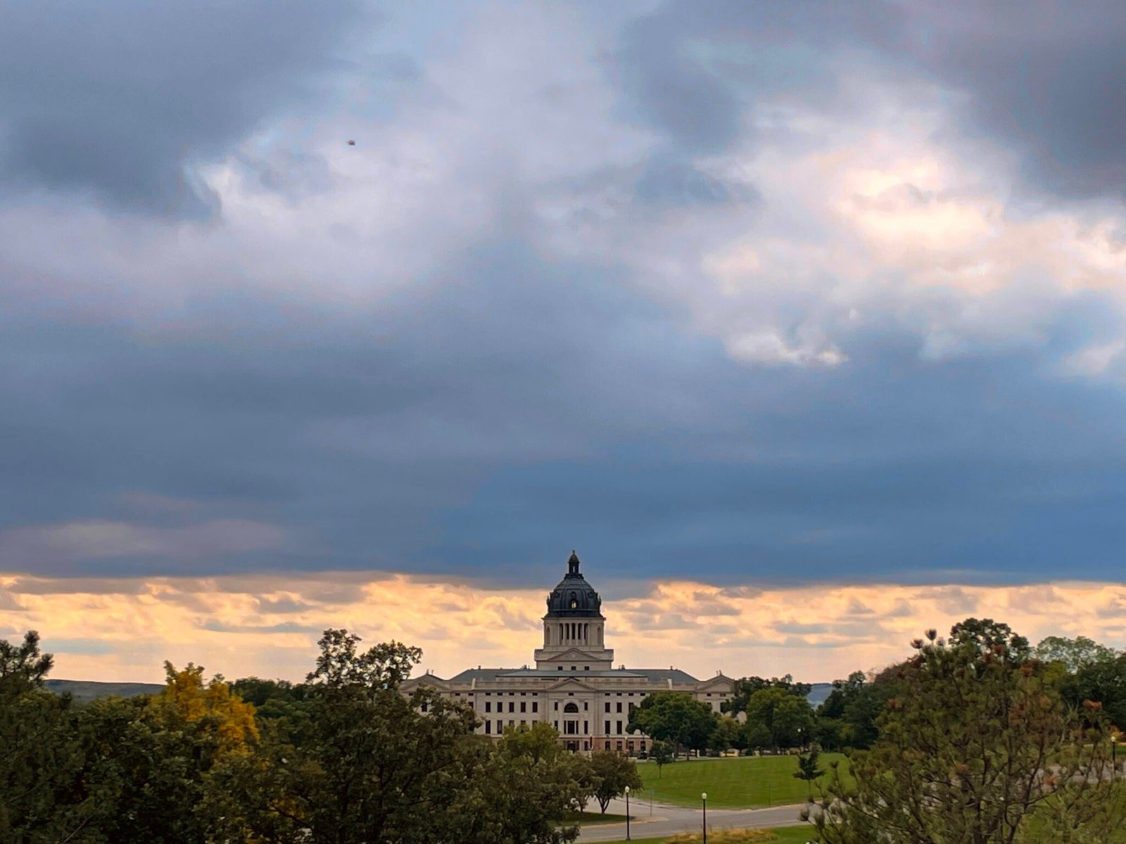 Clouds gather over the South Dakota Capitol building in Pierre on Sept. 17, 2022. (Seth Tupper/South Dakota Searchlight)