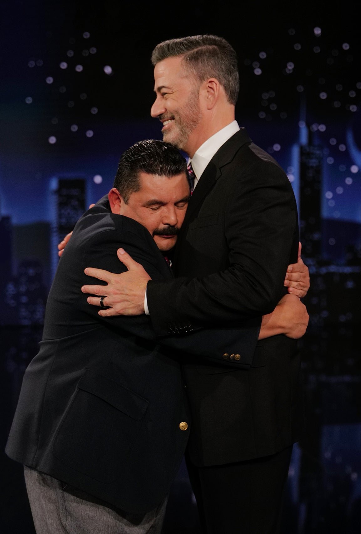 This photo published by Disney shows host Jimmy Kimmel, embraced by Guillermo Rodriguez on 
