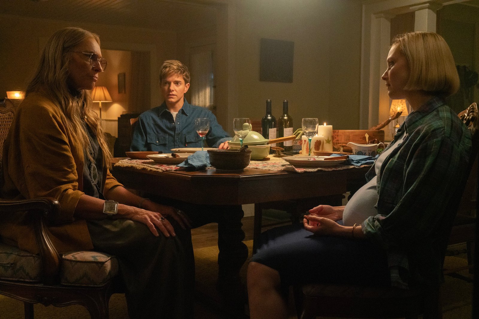Trans Cop Alex (Mae Martin, Center) moves to tall pine trees with pregnant wife Laura (Sarah Gadon)