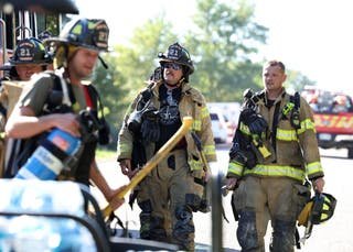 Firefighters from Atlas Township, returning to their vehicle after that